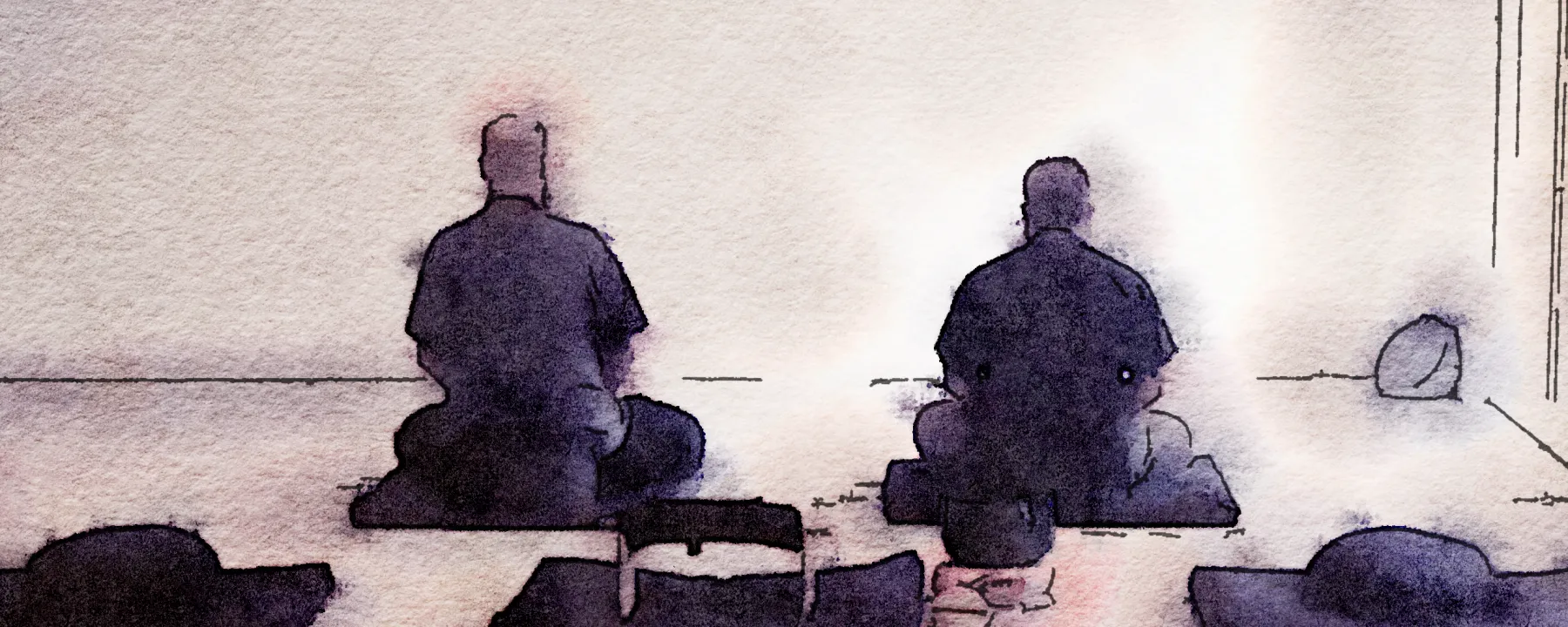 Two people sitting Zazen, side by side.  