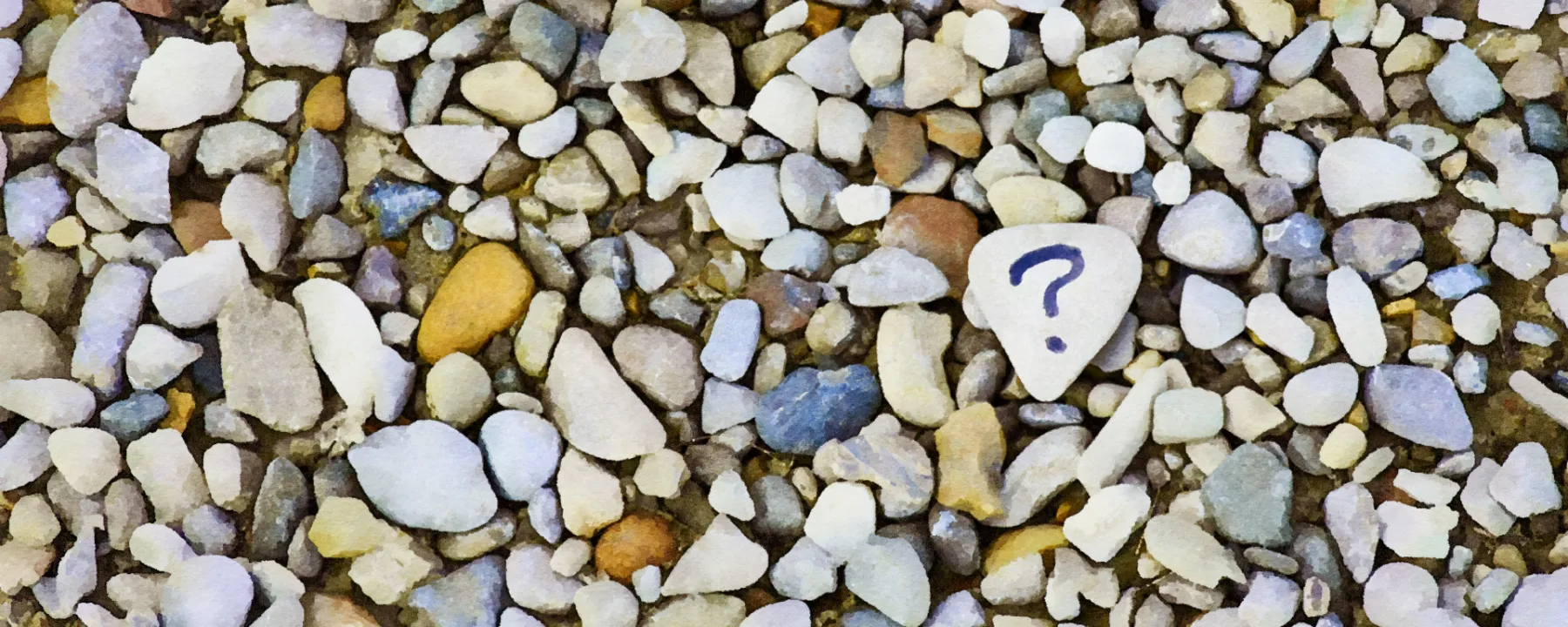 Watercolor of many rocks with a single rock with a question-mark among them.  Based on a photo by Ana Municio (Unsplash). 